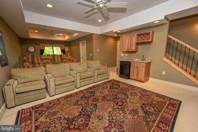 a living room with furniture and a rug