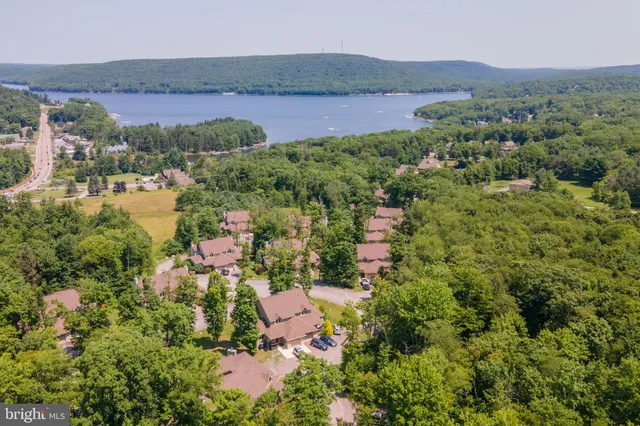 an aerial view of residential house with outdoor space and mountain view