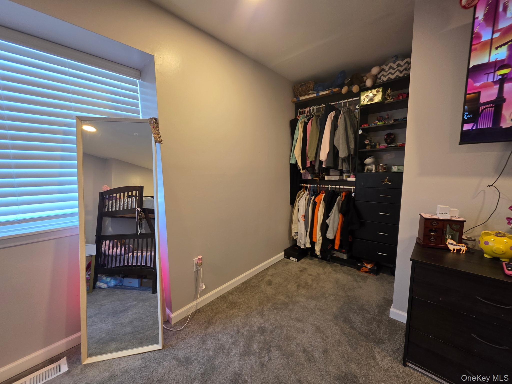 25 Pierces Road, Unit 3 Newburgh, NY 12550 - Photo 14 of 19 a view of walk in closet with clothes and shoes
