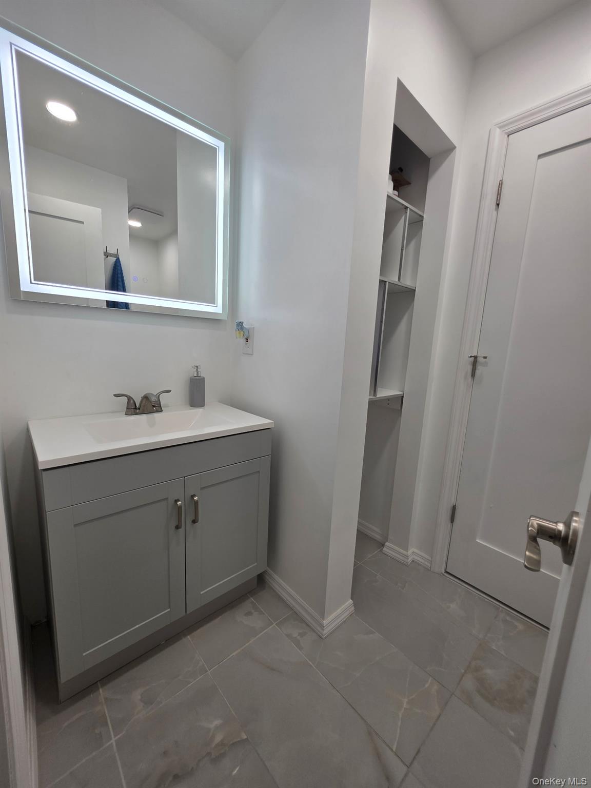 25 Pierces Road, Unit 3 Newburgh, NY 12550 - Photo 15 of 19 a bathroom with a sink and a mirror