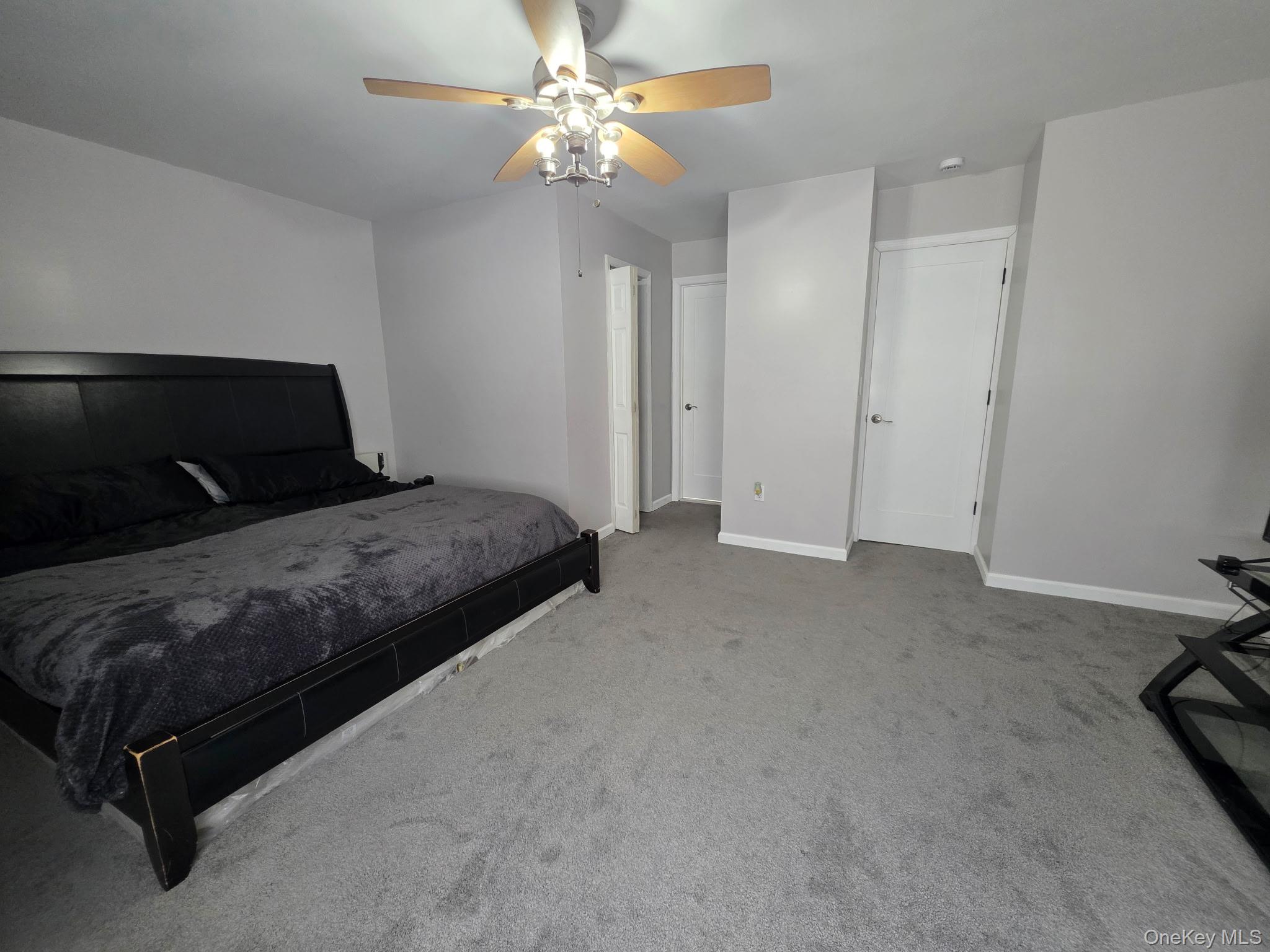 25 Pierces Road, Unit 3 Newburgh, NY 12550 - Photo 18 of 19 a bedroom with a bed and a ceiling fan