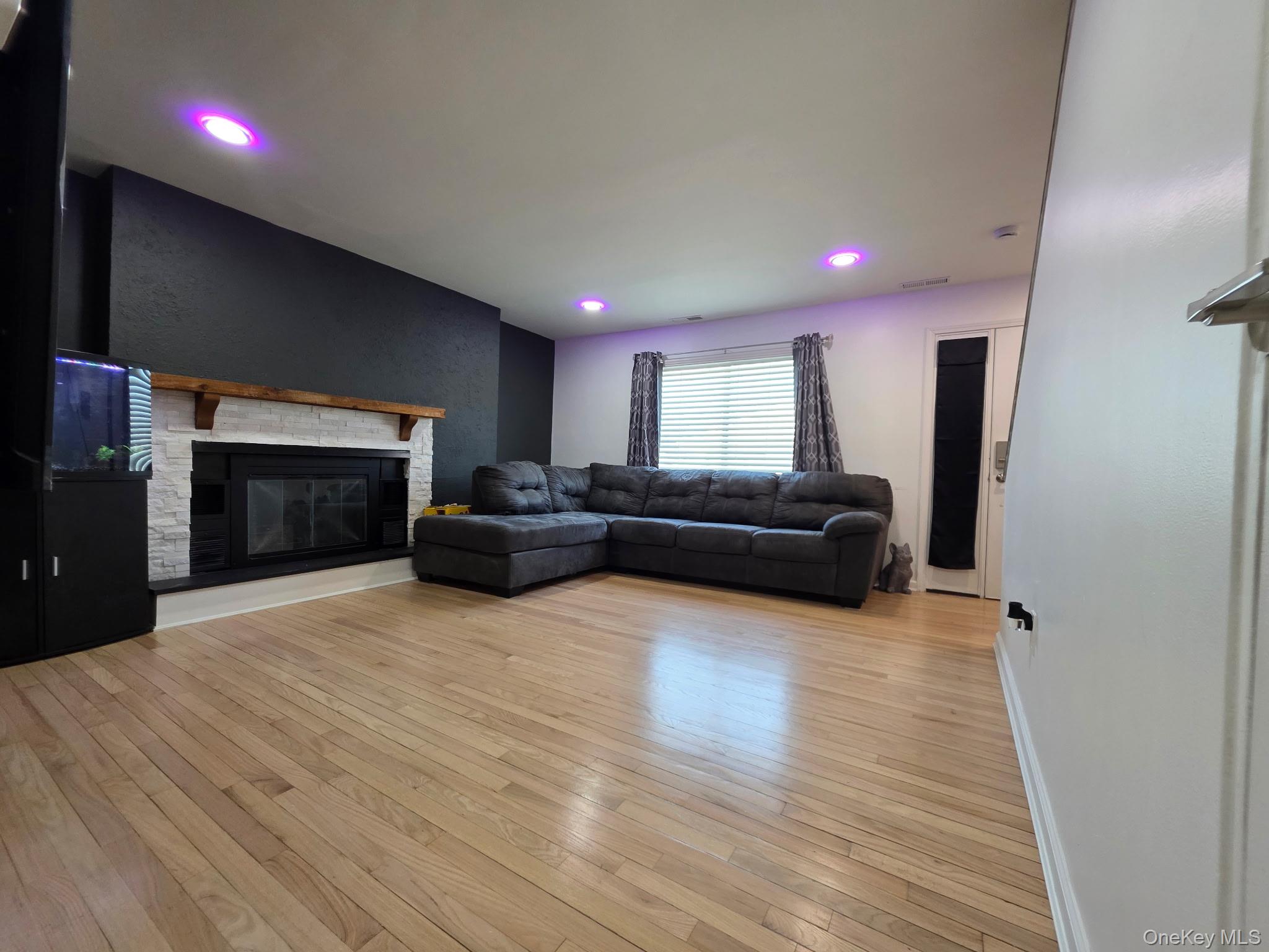 25 Pierces Road, Unit 3 Newburgh, NY 12550 - Photo 4 of 19 a living room with furniture and a fireplace