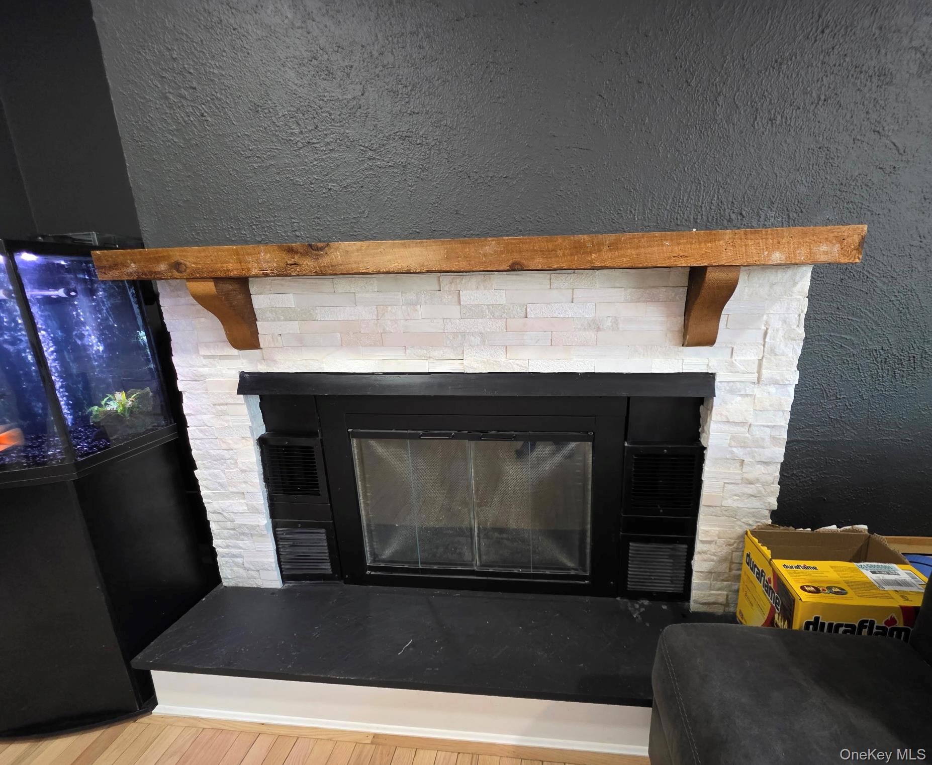 25 Pierces Road, Unit 3 Newburgh, NY 12550 - Photo 5 of 19 a living room with furniture and a fireplace