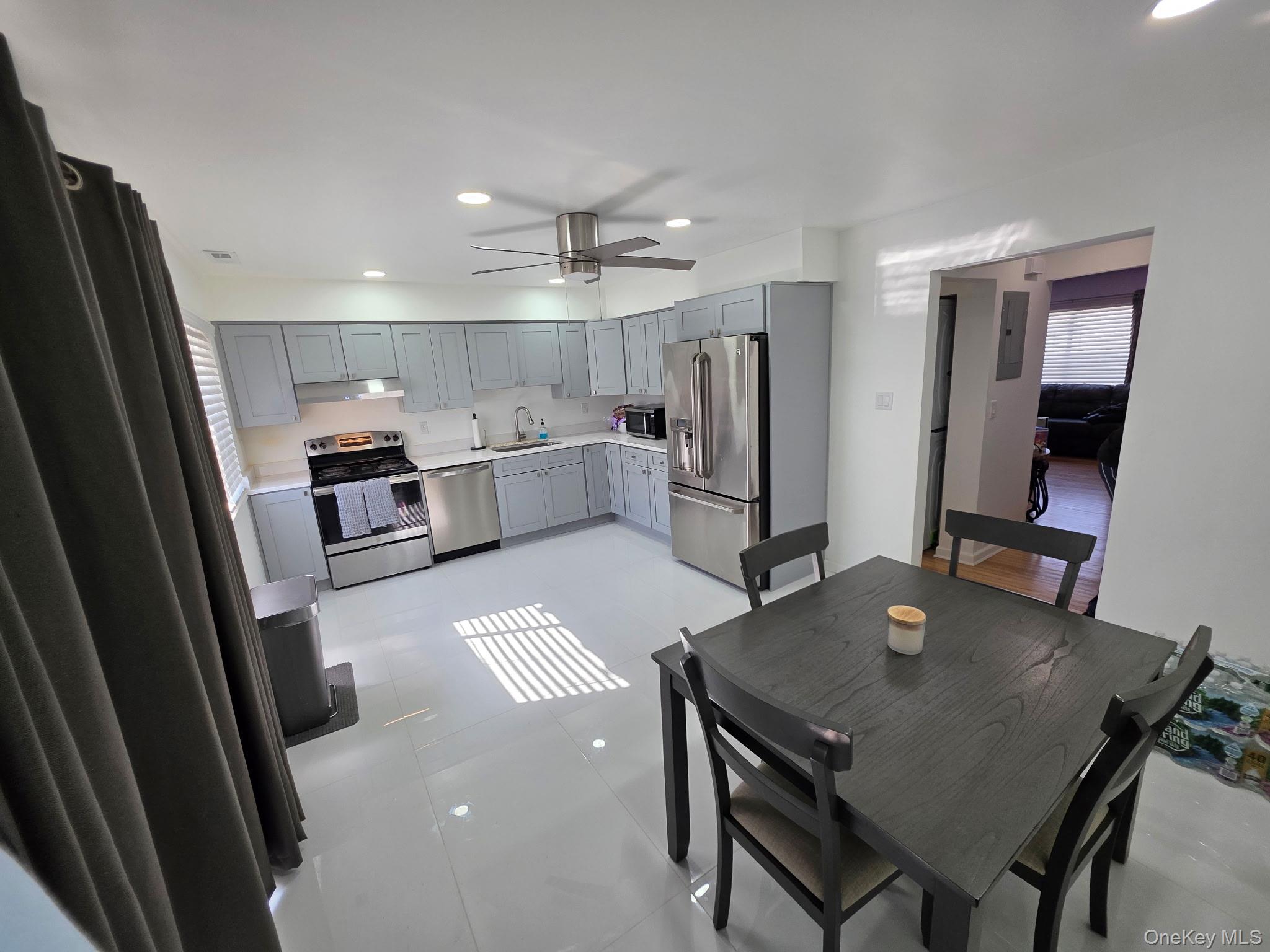 25 Pierces Road, Unit 3 Newburgh, NY 12550 - Photo 7 of 19 a kitchen with refrigerator and window