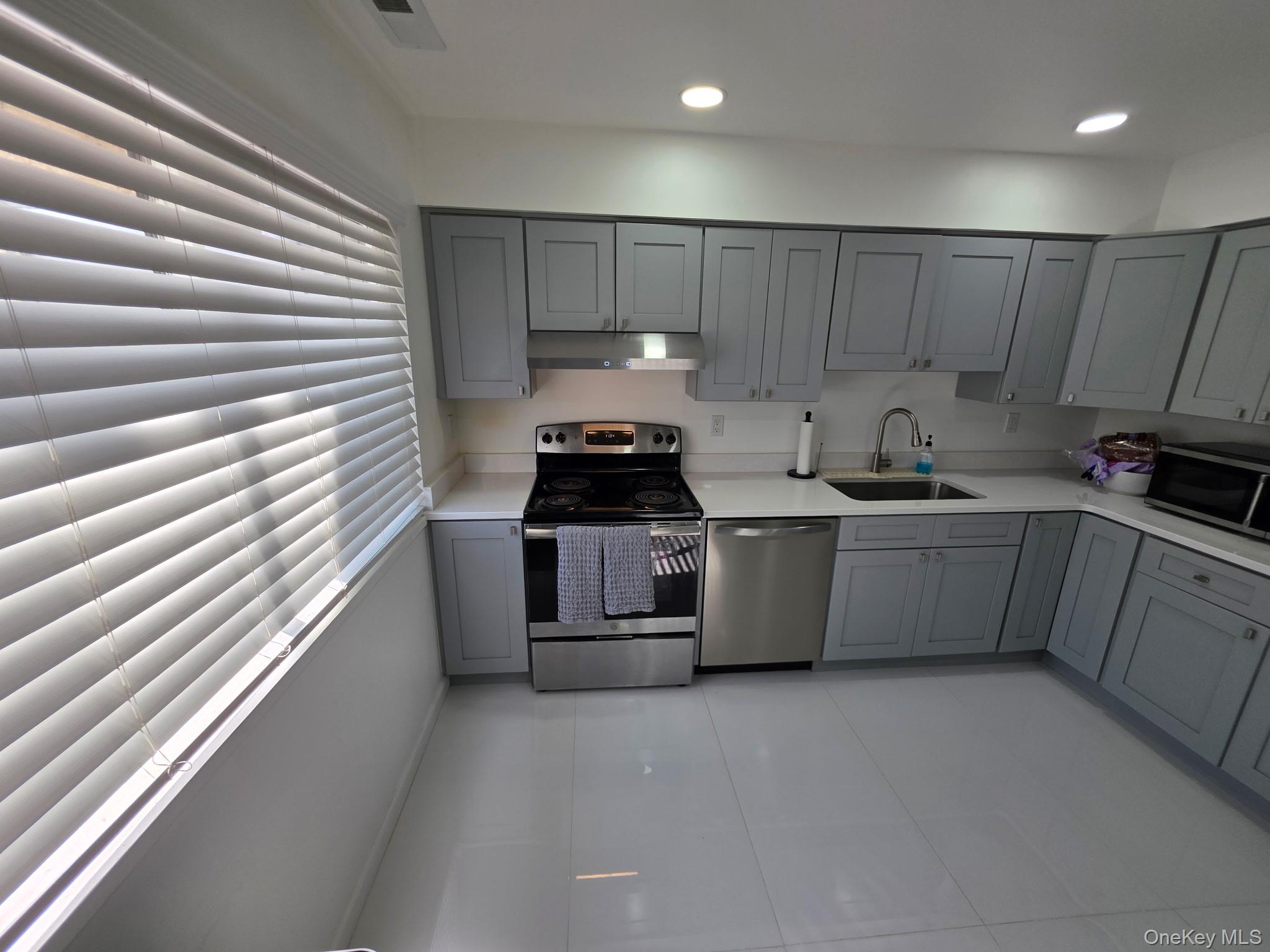 25 Pierces Road, Unit 3 Newburgh, NY 12550 - Photo 8 of 19 a kitchen with a sink and cabinets