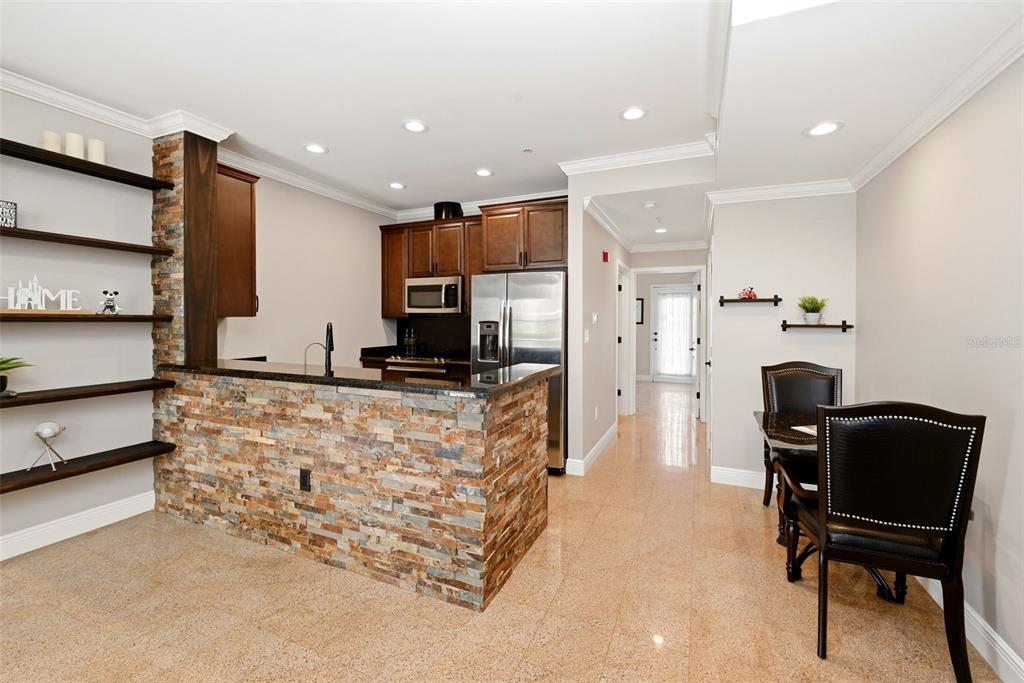 709 Bloom Street, Unit 160 Celebration, FL 34747 - Photo 11 of 35 a living room with furniture and a flat screen tv