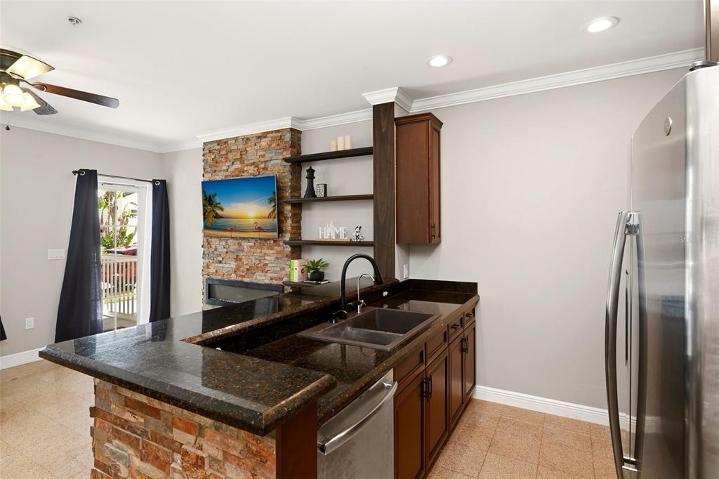 709 Bloom Street, Unit 160 Celebration, FL 34747 - Photo 12 of 35 a kitchen with stainless steel appliances granite countertop a sink and a refrigerator