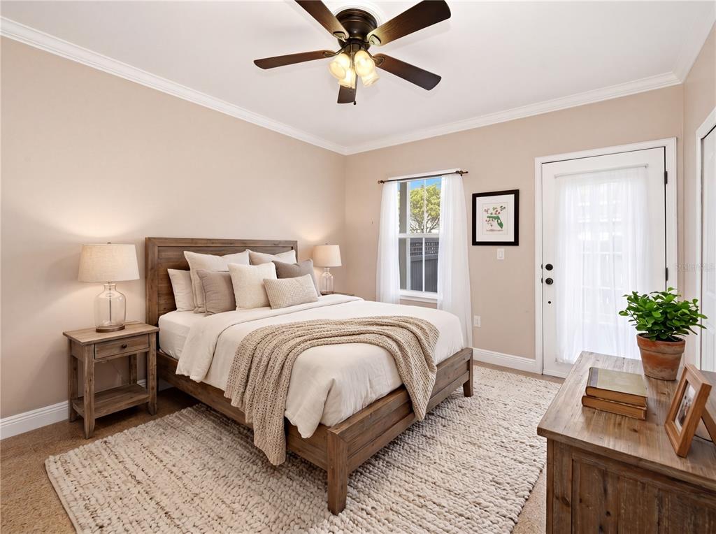 709 Bloom Street, Unit 160 Celebration, FL 34747 - Photo 17 of 35 a bedroom with a bed and a chandelier