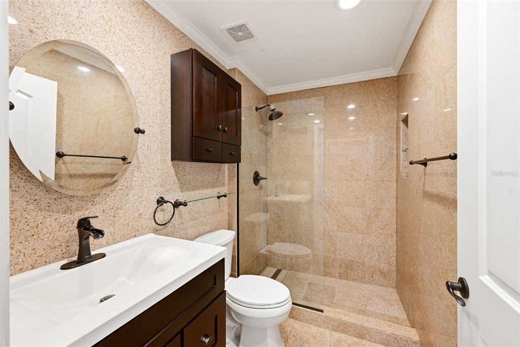 709 Bloom Street, Unit 160 Celebration, FL 34747 - Photo 20 of 35 a bathroom with a sink toilet vanity and shower