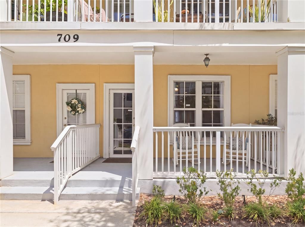 709 Bloom Street, Unit 160 Celebration, FL 34747 - Photo 2 of 35 a front view of a house with a porch