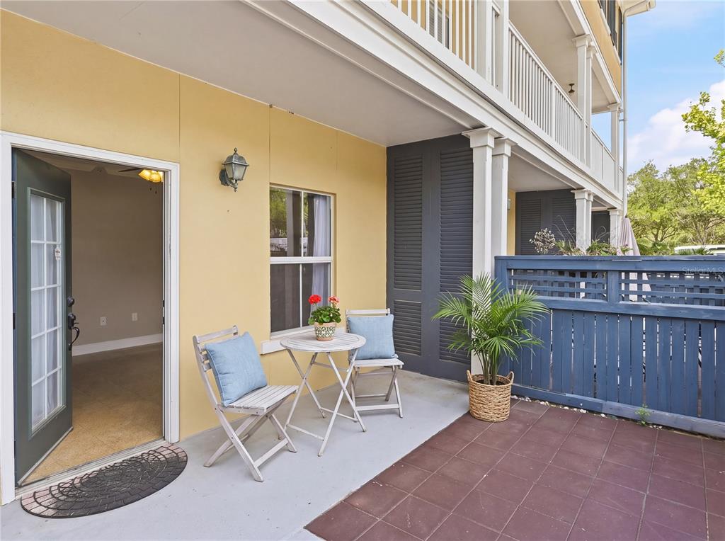 709 Bloom Street, Unit 160 Celebration, FL 34747 - Photo 22 of 35 a view of a house with backyard and sitting area