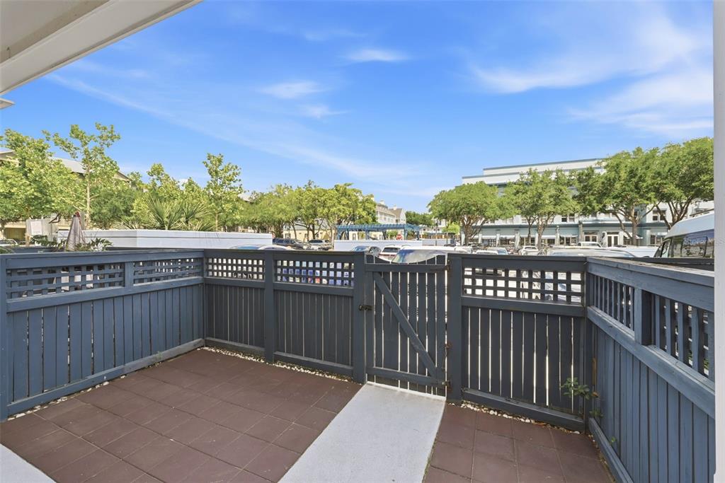 709 Bloom Street, Unit 160 Celebration, FL 34747 - Photo 23 of 35 a view of a balcony with wooden floor and fence