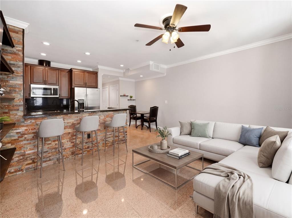709 Bloom Street, Unit 160 Celebration, FL 34747 - Photo 3 of 35 a living room with furniture and a view of kitchen