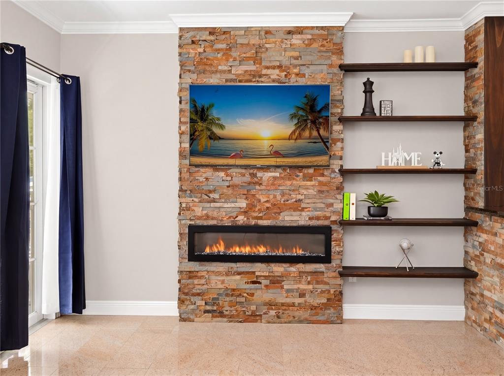 709 Bloom Street, Unit 160 Celebration, FL 34747 - Photo 5 of 35 a view of fireplace in kitchen