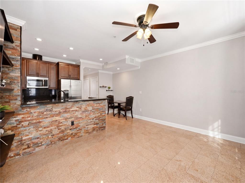 709 Bloom Street, Unit 160 Celebration, FL 34747 - Photo 6 of 35 a view of a kitchen with a stove and a ceiling fan