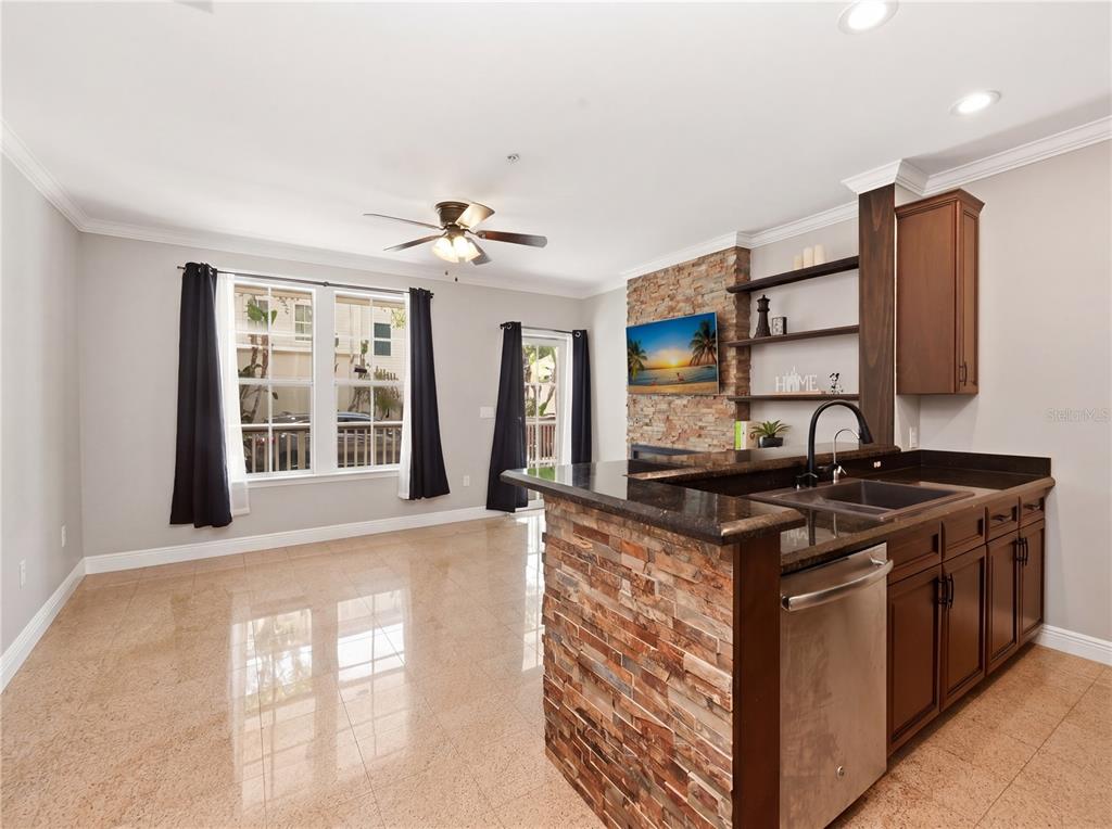 709 Bloom Street, Unit 160 Celebration, FL 34747 - Photo 7 of 35 a kitchen with stainless steel appliances granite countertop a sink stove and cabinets
