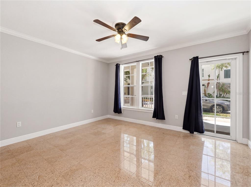 709 Bloom Street, Unit 160 Celebration, FL 34747 - Photo 8 of 35 an empty room with windows and ceiling fan
