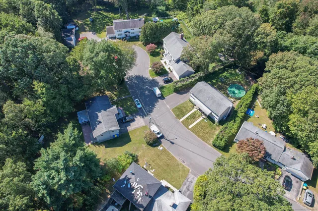 an aerial view of a house with a garden