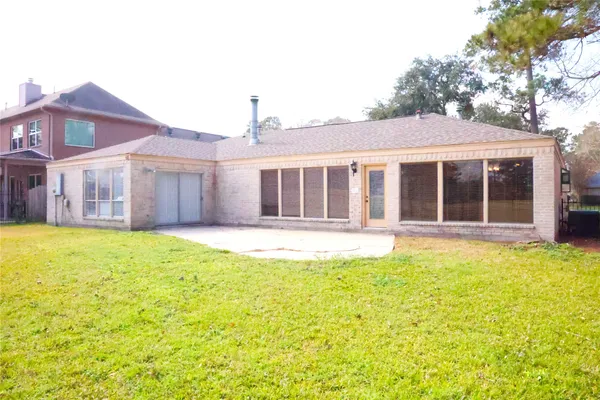 a view of an ocean and a yard with trees