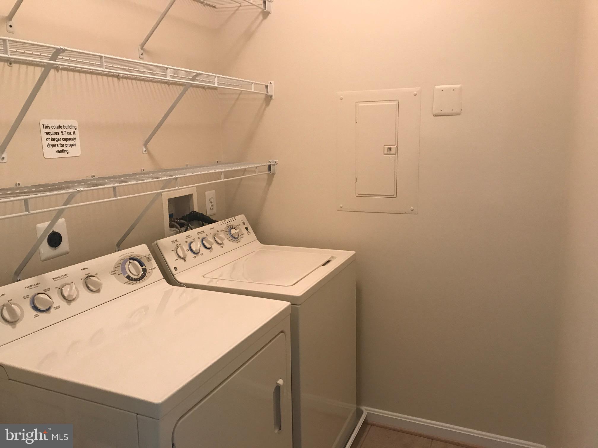 8601 Roaming Ridge Way, Unit 402 Odenton, MD 21113 - Photo 22 of 30 a utility room with dryer and washer