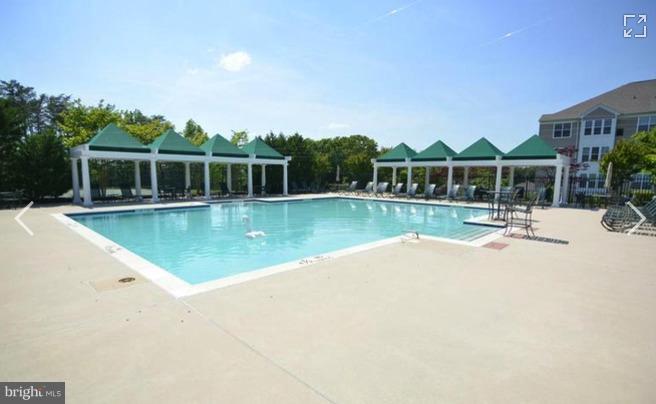 8601 Roaming Ridge Way, Unit 402 Odenton, MD 21113 - Photo 30 of 30 swimming pool view with a outdoor space