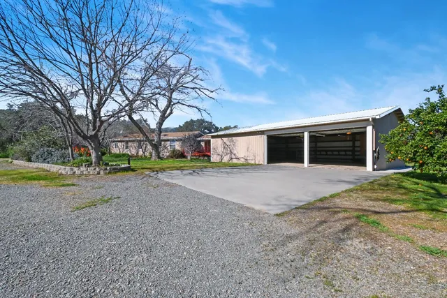 a view of a two chairs in the balcony