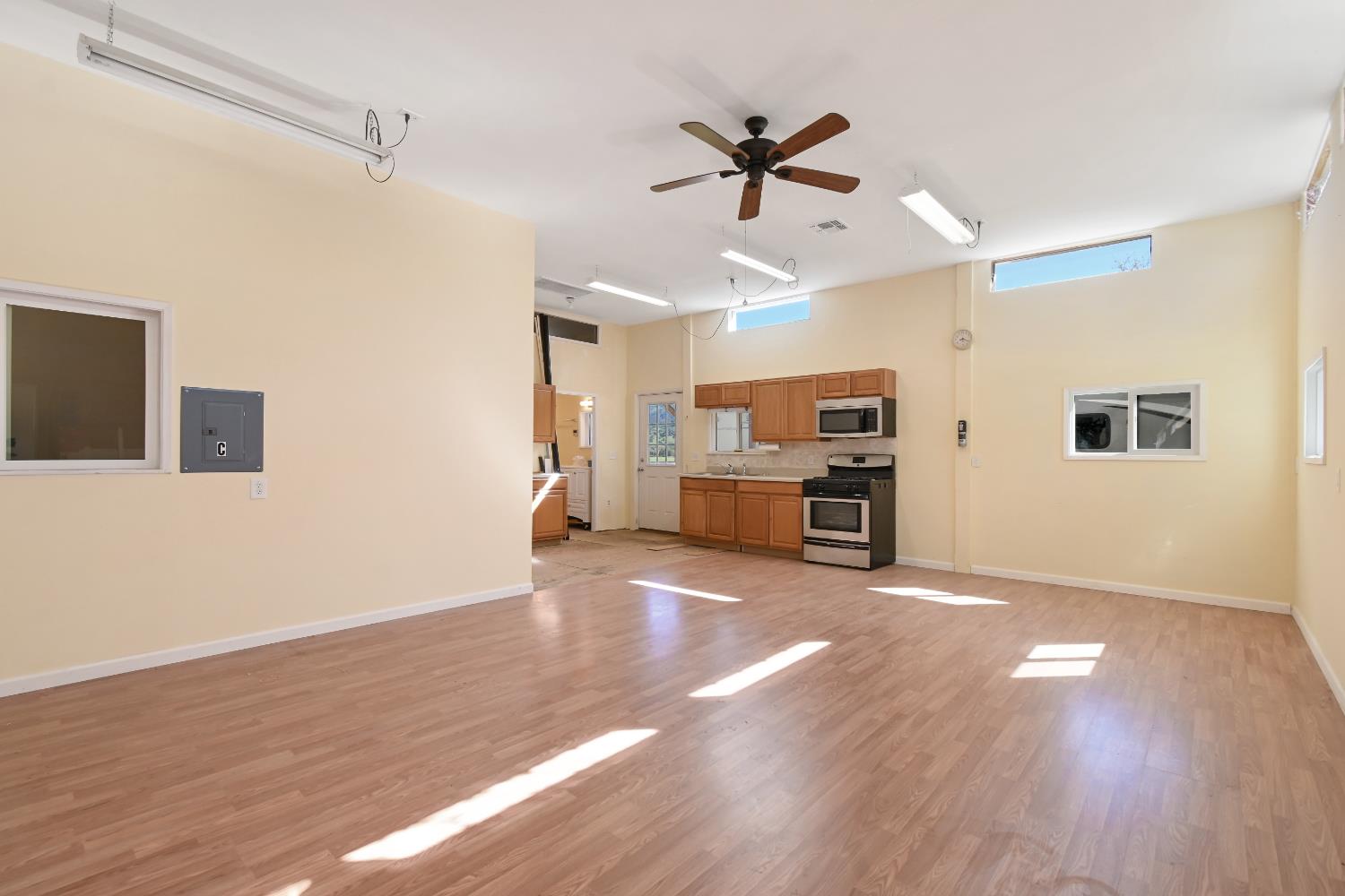15655 County Road 45 Guinda, CA 95637 - Photo 41 of 66 a view of a kitchen with a sink cabinet a ceiling fan and wooden floor