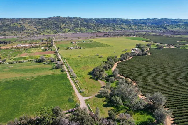 a bathroom with a sink mirror and a bathtub