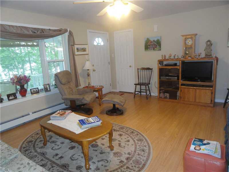 143 Norway Road Harrison, ME 04040 - Photo 14 of 20 Living Room. Door onto front deck...