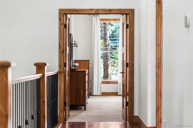a bedroom with a bed couch and a flat tv screen