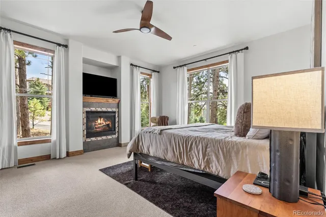 a spacious bathroom with a granite countertop sink and a mirror