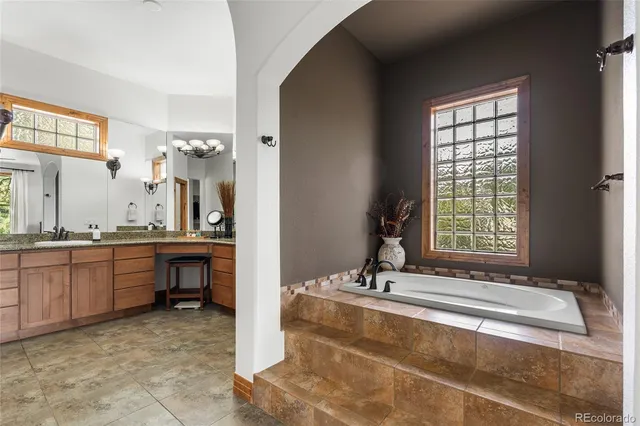 a bathroom with a shower and a sink