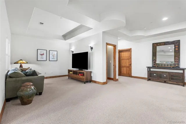 a kitchen with a table chairs refrigerator and microwave