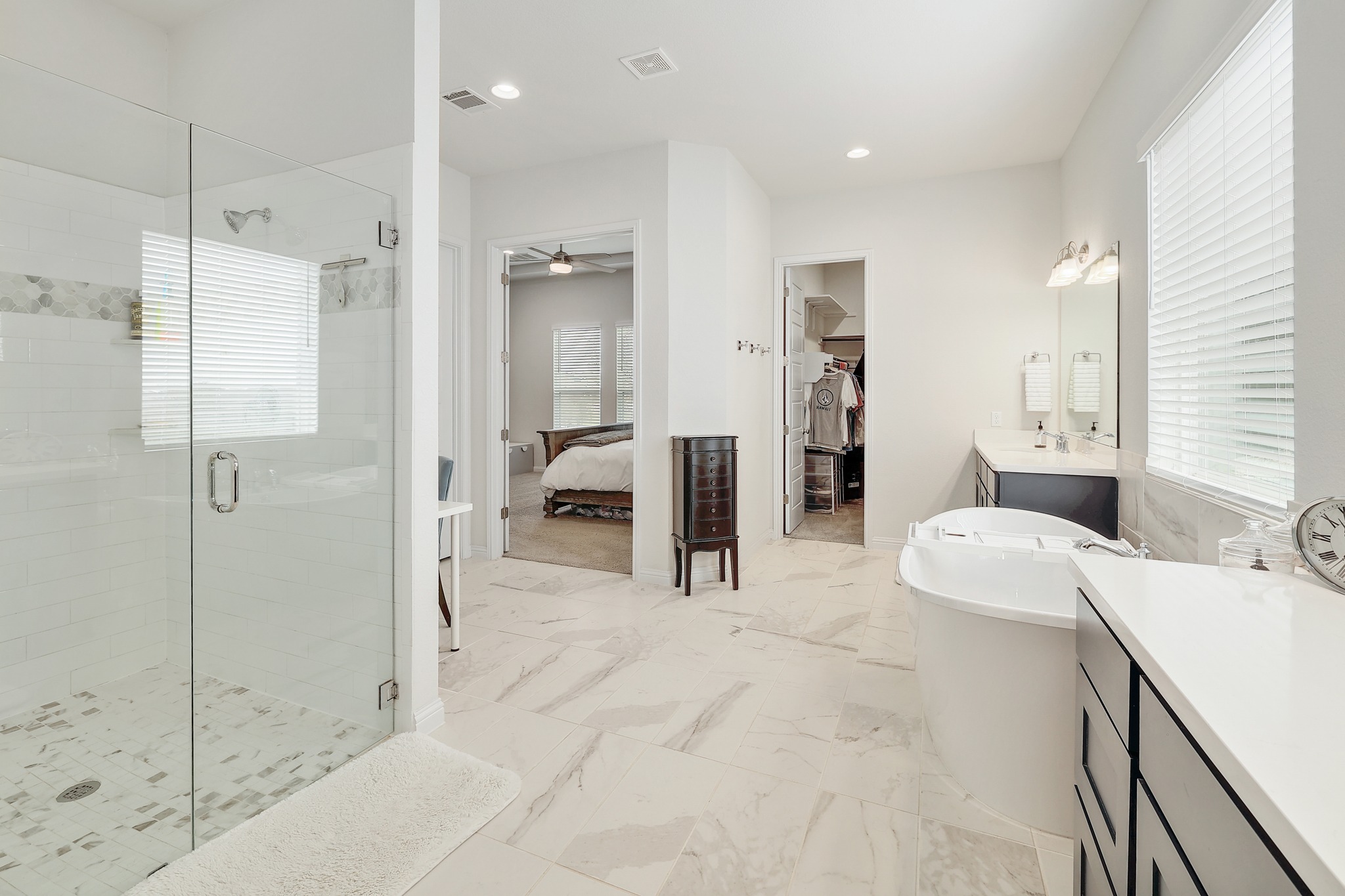 108 Argo Cove Georgetown, TX 78628 - Photo 15 of 36 Bathroom with vanity, a spacious closet, a stall shower, ensuite bath, and recessed lighting