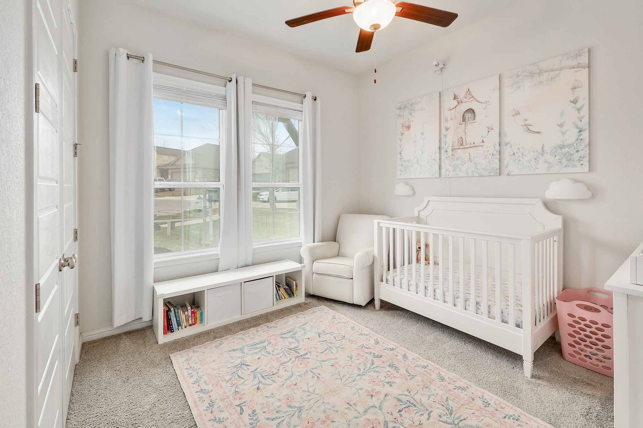 108 Argo Cove Georgetown, TX 78628 - Photo 20 of 36 Bedroom with light carpet, ceiling fan, and a nursery area