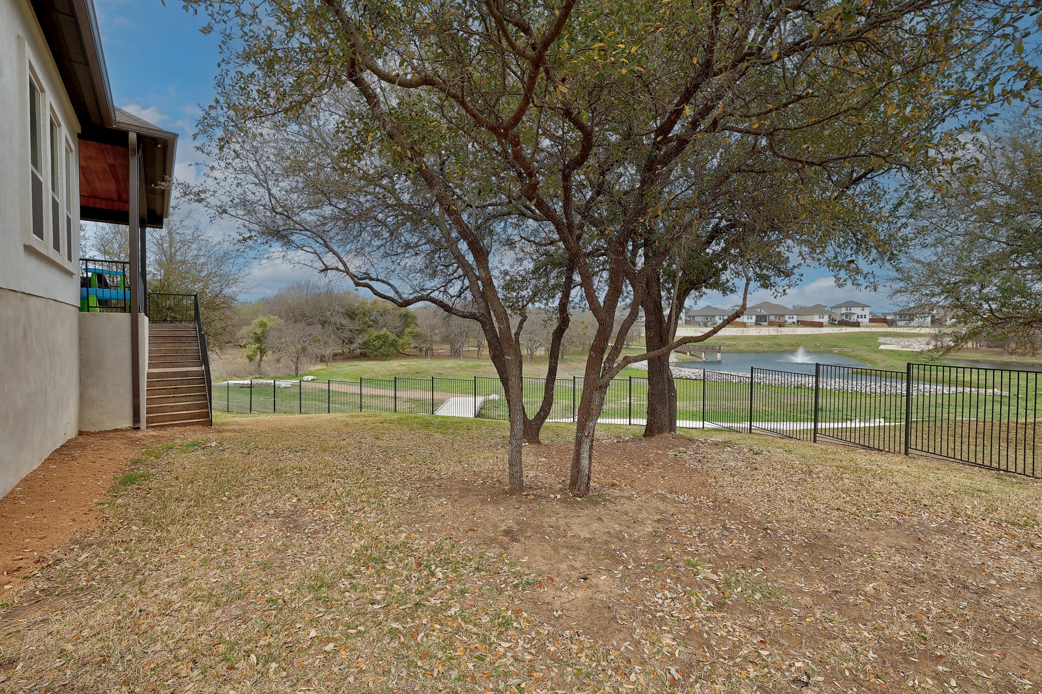 108 Argo Cove Georgetown, TX 78628 - Photo 35 of 36 View of yard with a water view and stairs