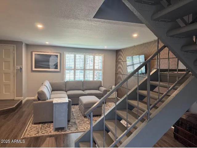 a living room with furniture or stairs and a couch