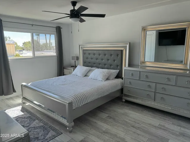 a bedroom with a bed and a window