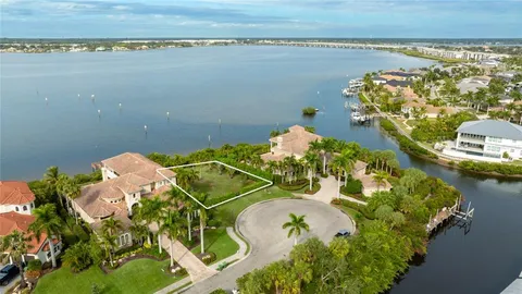 an aerial view of a residential houses with outdoor space and seating