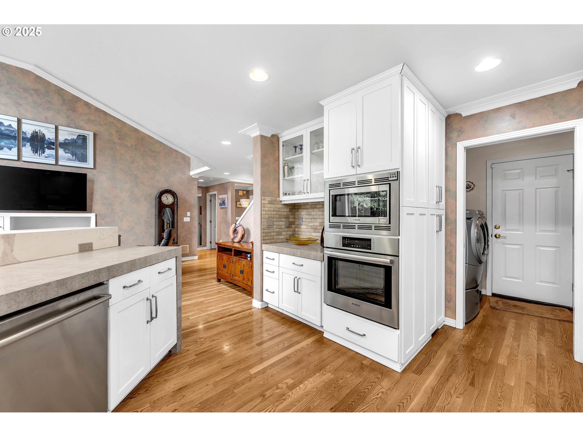 3496 Chaparrel Loop West Linn, OR 97068 - Photo 15 of 41 a kitchen with stainless steel appliances kitchen island granite countertop a stove top oven and sink