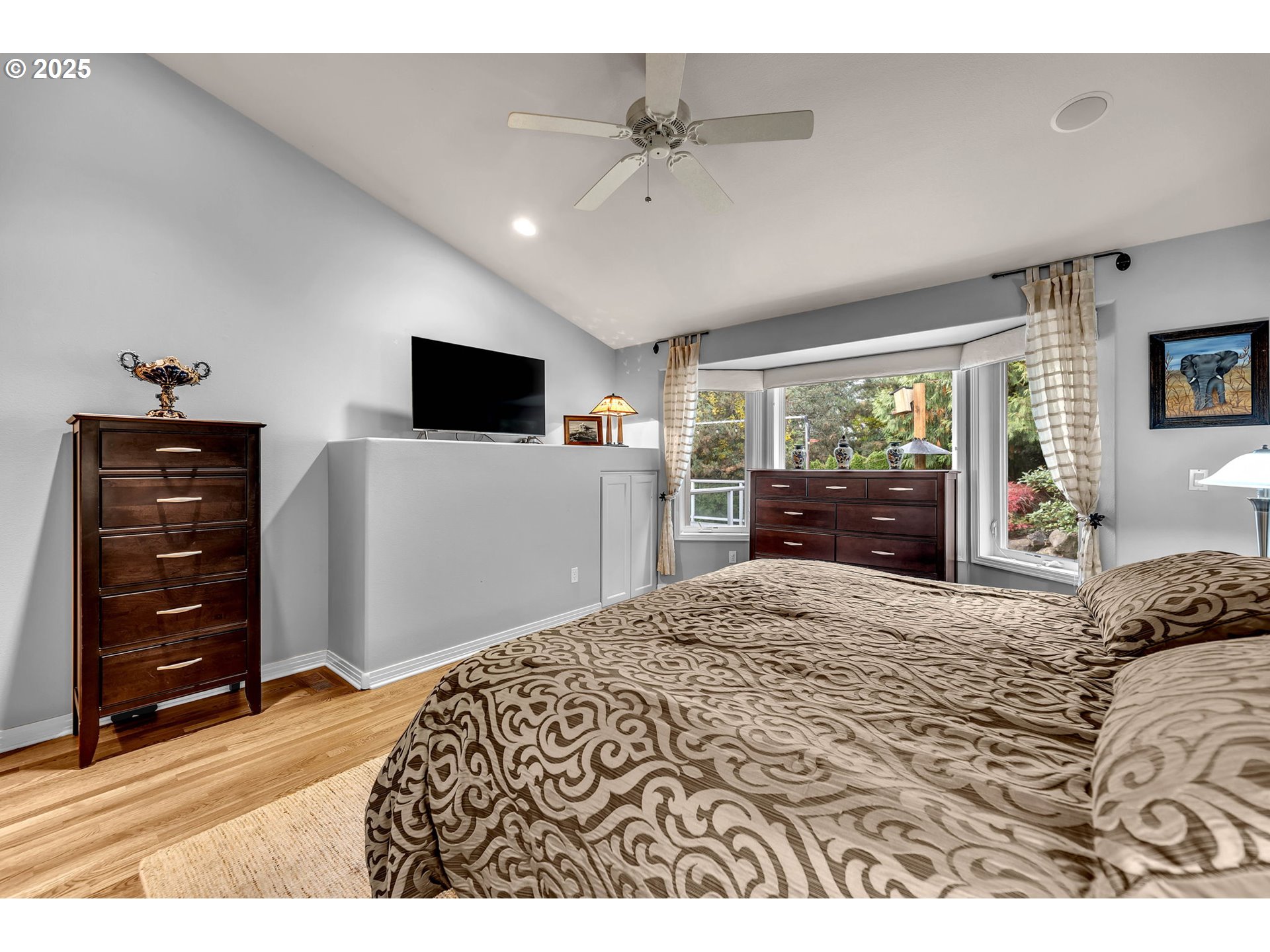 3496 Chaparrel Loop West Linn, OR 97068 - Photo 20 of 41 a bedroom with a bed and a flat screen tv