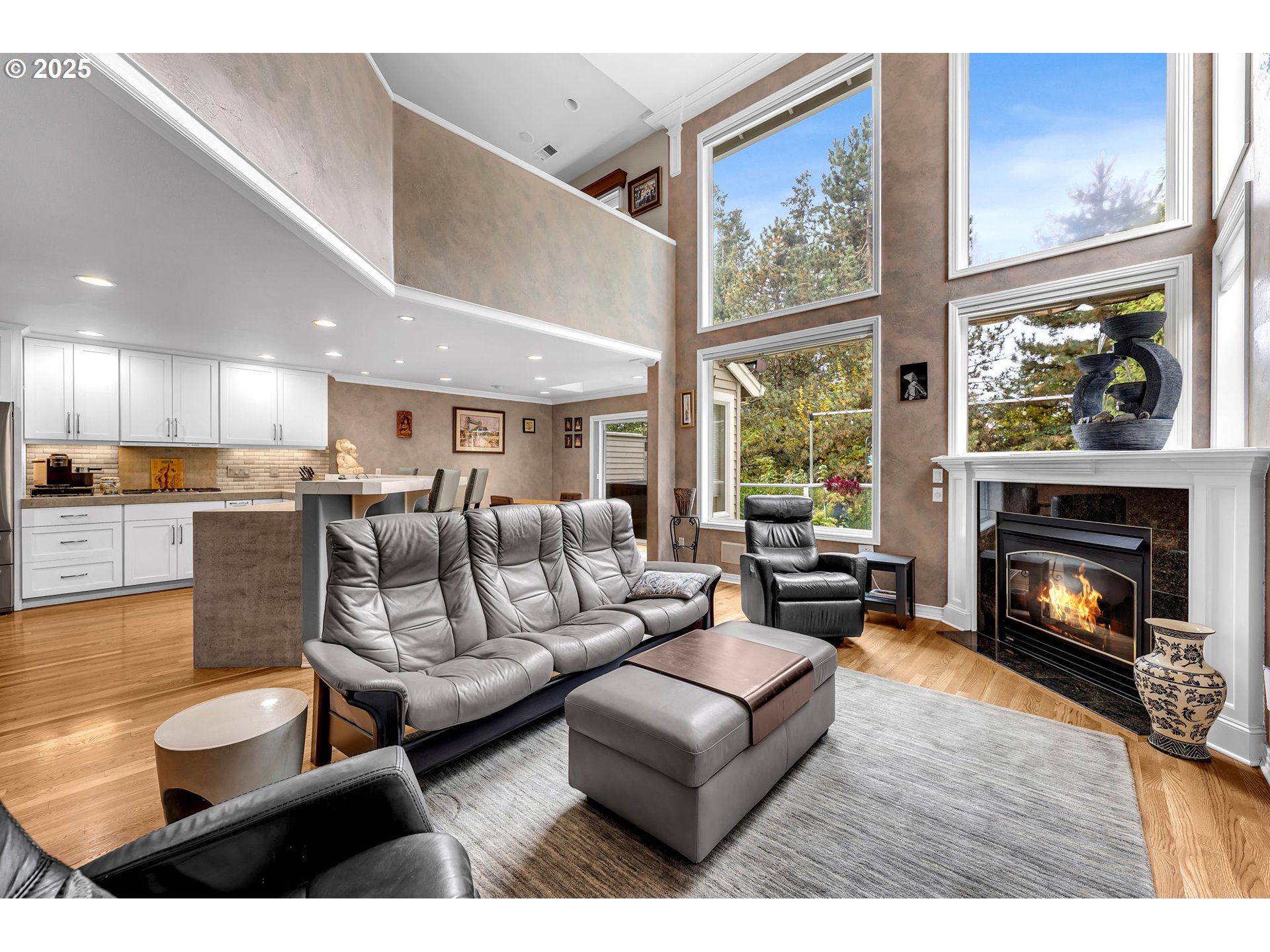 3496 Chaparrel Loop West Linn, OR 97068 - Photo 6 of 41 a living room with furniture fireplace and a large window