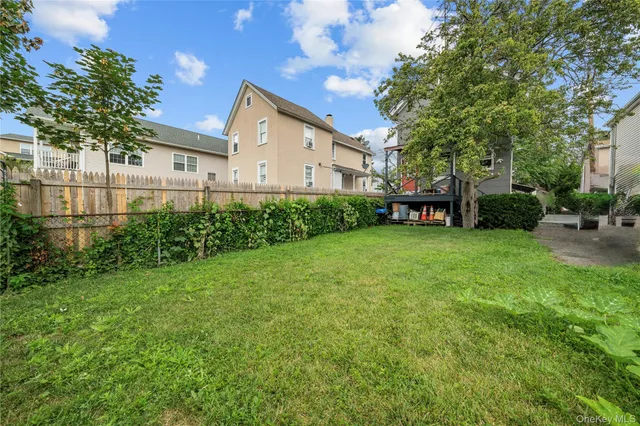 a view of a backyard with plants and a patio