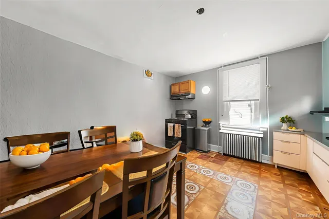 a dining room with a table and chairs