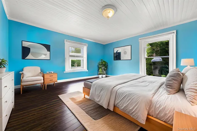 a bedroom with a bed and a couch