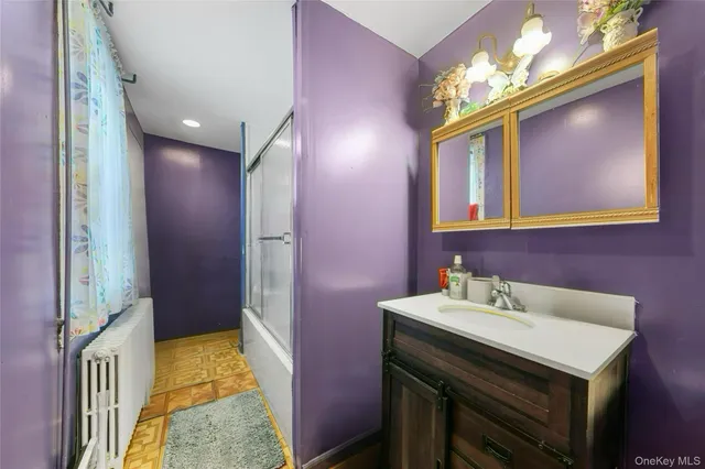 a bathroom with a sink a vanity and a mirror