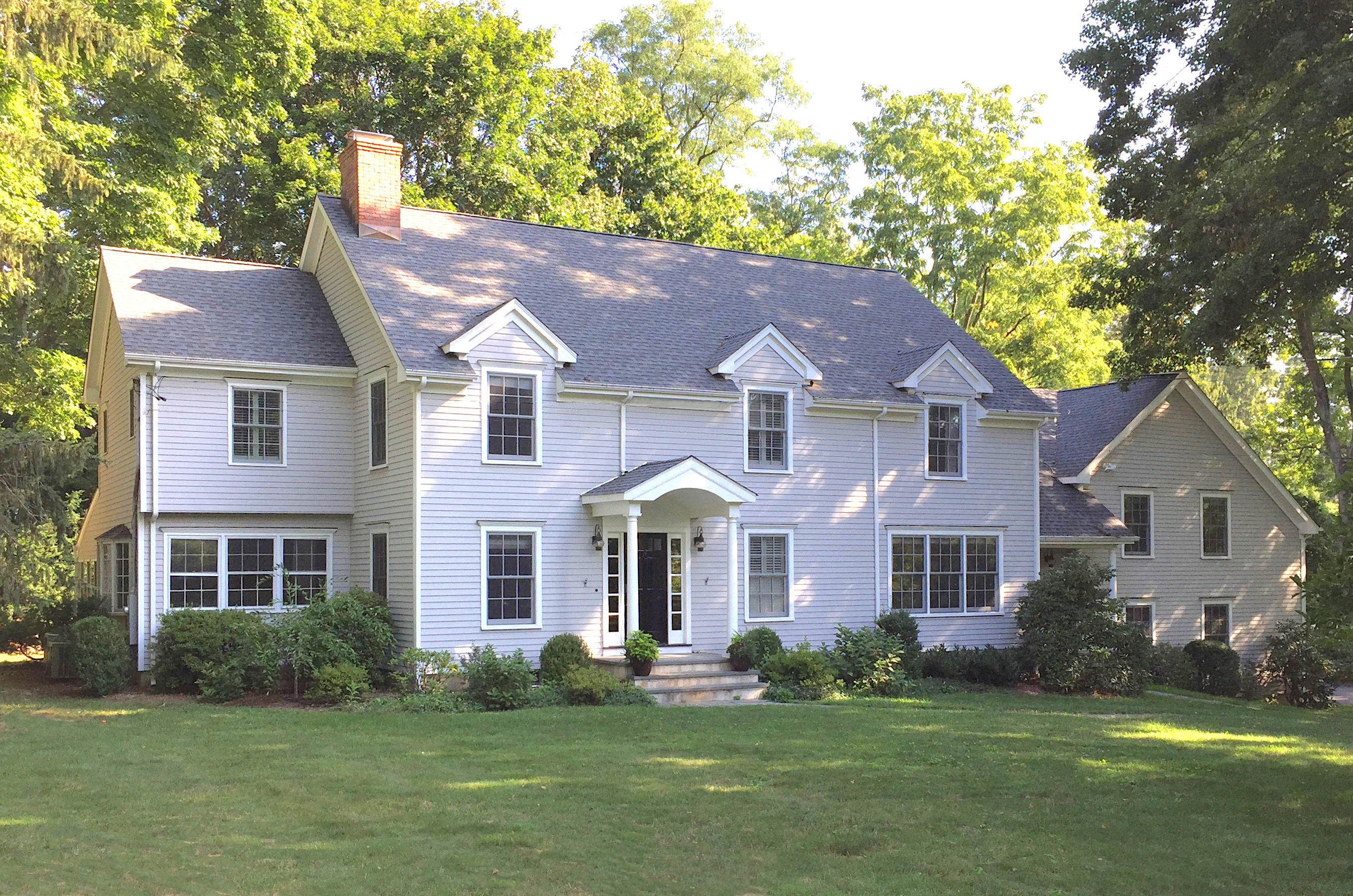 181 Middlesex Road Darien, CT 06820 - Photo 1 of 38 a front view of a house with a garden and yard