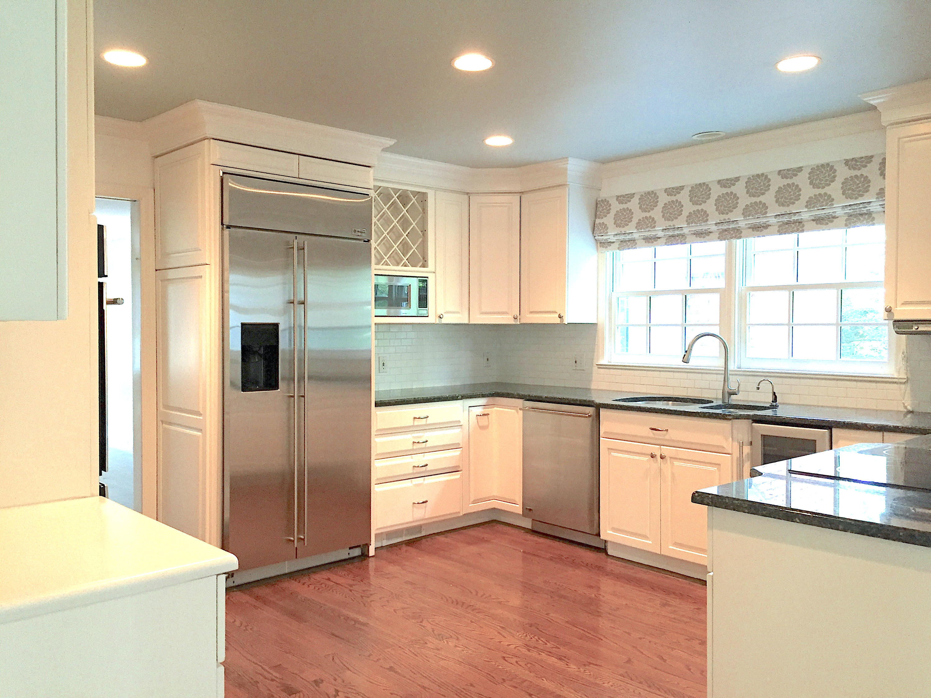 181 Middlesex Road Darien, CT 06820 - Photo 13 of 38 a kitchen with granite countertop a refrigerator and a sink