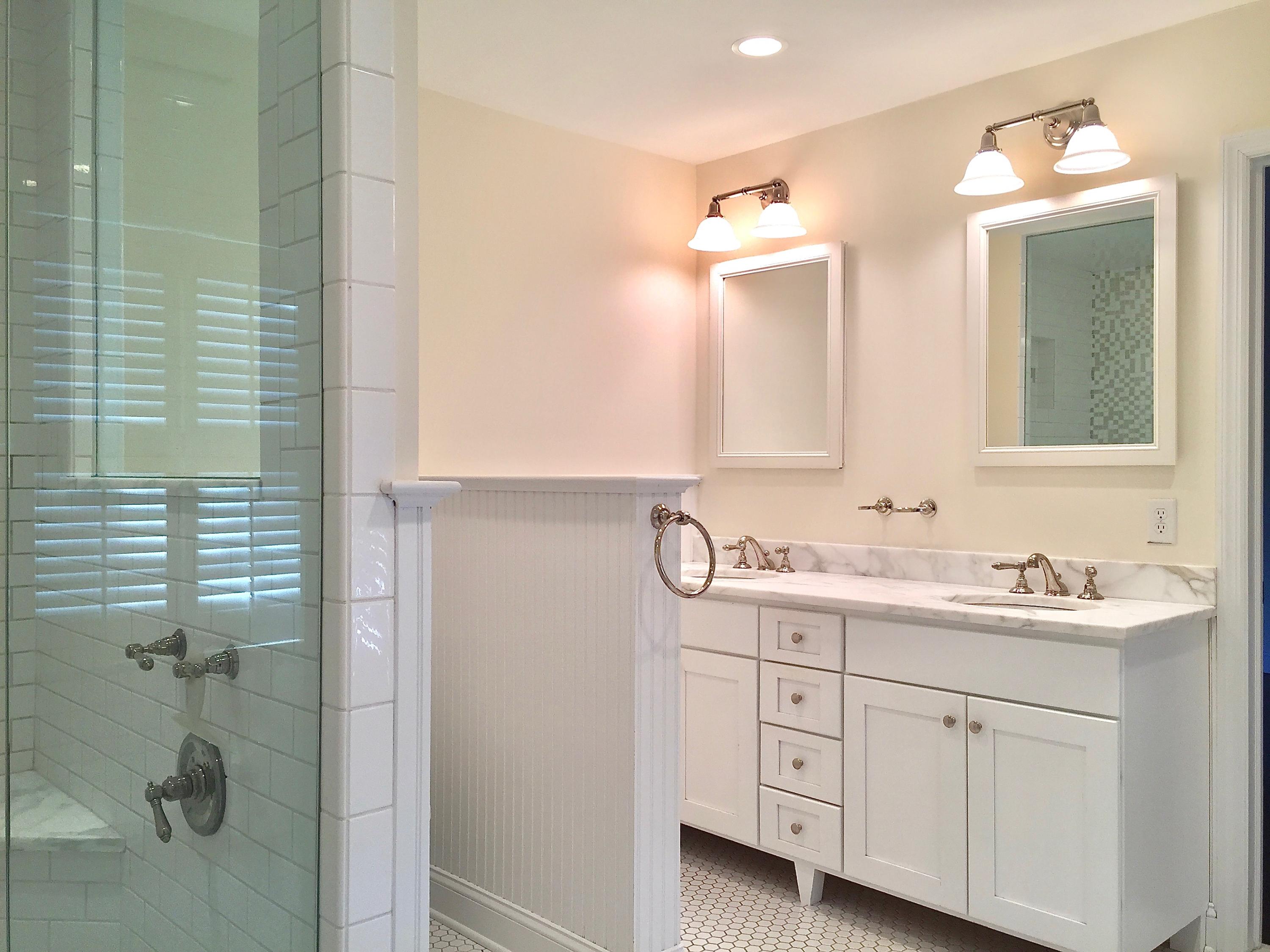 181 Middlesex Road Darien, CT 06820 - Photo 24 of 38 a bathroom with a double vanity sink and mirror