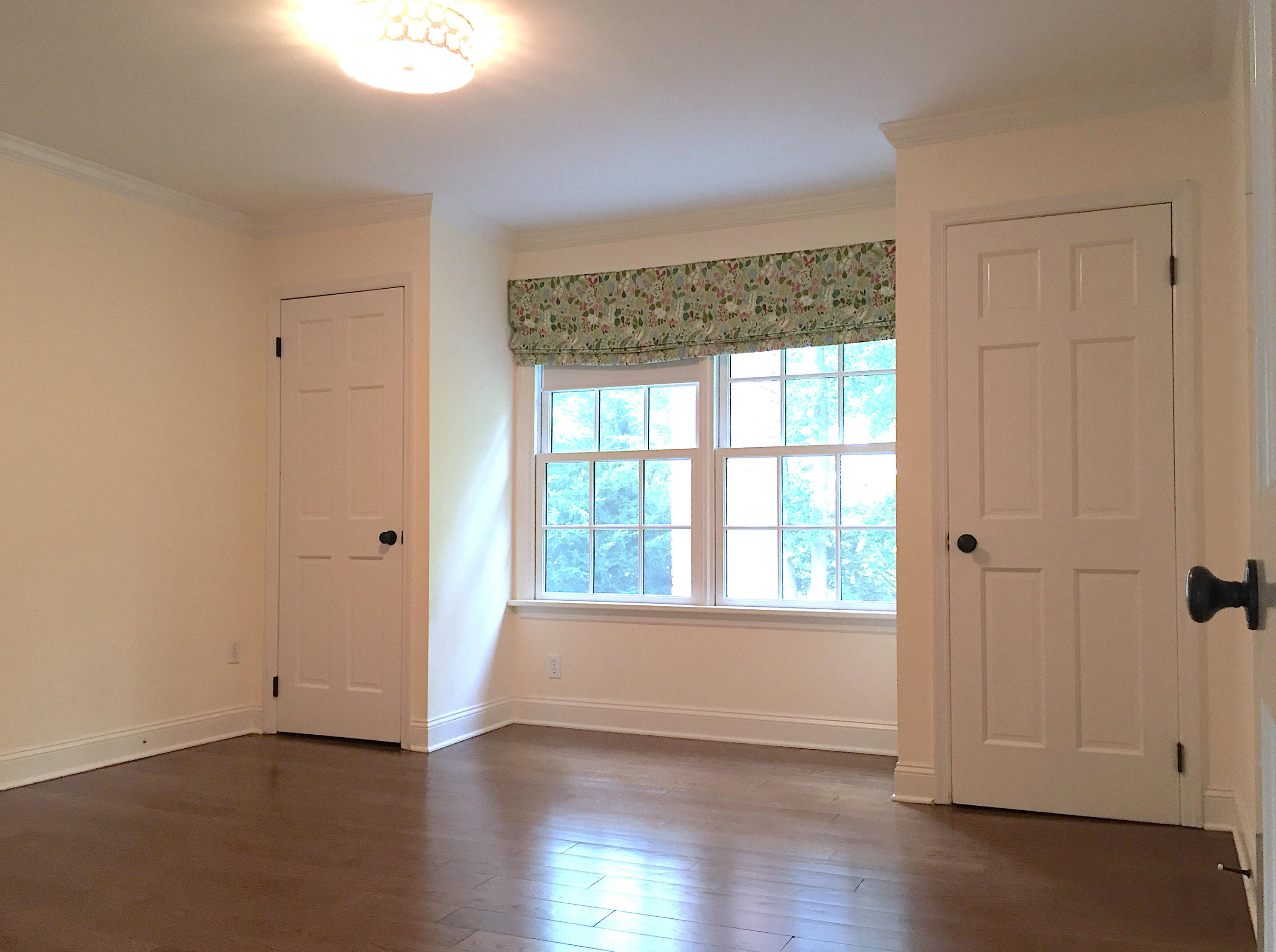 181 Middlesex Road Darien, CT 06820 - Photo 26 of 38 an empty room with wooden floor and windows